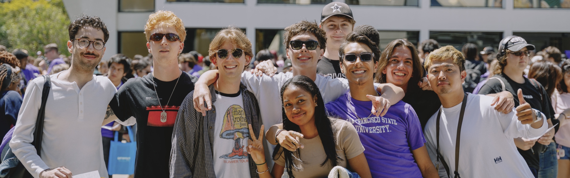 Students standing in front of library. 